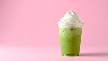 Aesthetic Iced Matcha Coffee Latte in Clear Cup with Pink-Green Milk Layers and Whipped Cream, Set Against a Pastel Pink Background with Soft Shadows and Minimal Styling