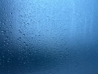 Water Droplets on Foggy Glass – Blue Cold Weather Background
