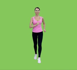 Smiling slim mid adult woman in pink tank top and black leggings jogging on green chroma key...