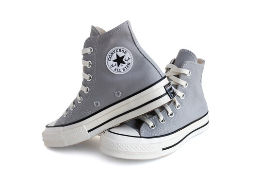 Converse Chuck Taylor High grey sneaker on white background.