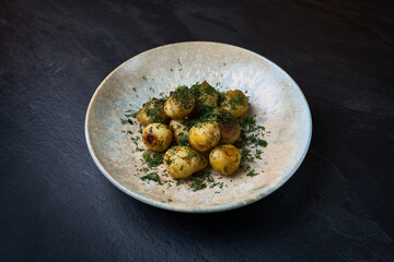 Roasted baby potatoes with fresh dill garnish