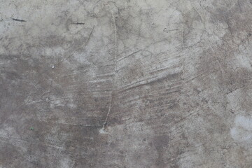 Close-up of weathered concrete surface with cracks and textures