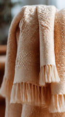 Beige textile plaid, boho-style home decor in neutral colors
