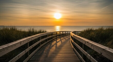 Fototapeta premium Wooden walkway leading to ocean at sunset boardwalk