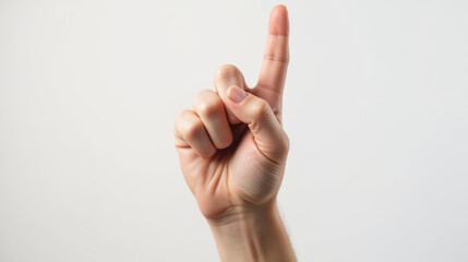 Pointing finger gesture, indicating direction or emphasis, conveys communication and expression
