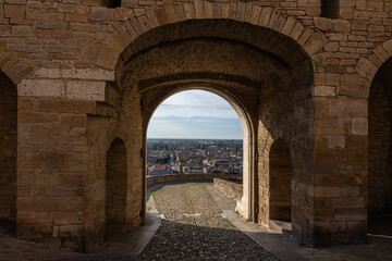 Porta San Giacomo viewed from behind with Bergamo cityscape in the background