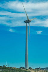 Wind turbine under cloudy sky