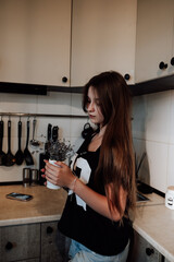 girl with long hair in the kitchen