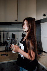 girl with long hair in the kitchen