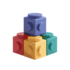 Colorful toy building blocks stacked in a pyramid on a white background with copy space