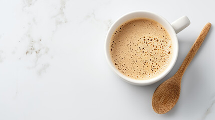 Top-down view of  ceramic coffee mug filled with creamy coffee, beverage,mug.