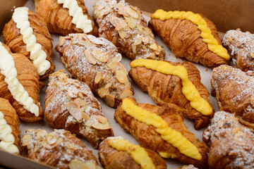 croissants with different fillings in a large box