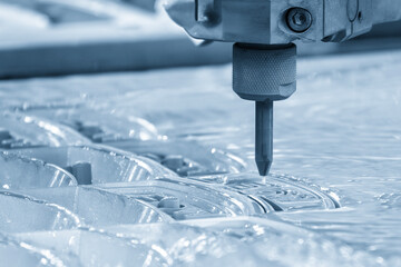 Close-up scene of multi-axis abrasive waterjet cutting machine cut the aluminum plate in the light...