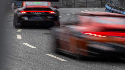 Motion blur race car racing on speed track, Motion blurred super car race on street track circuit,...