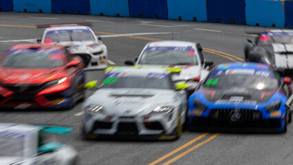Motion blur race car racing on speed track, Motion blurred super car race on street track circuit,...