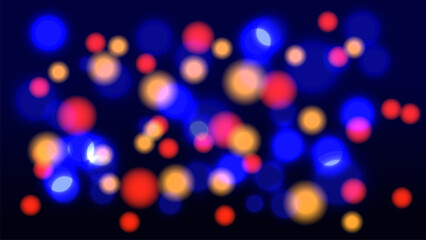 Abstract multicolor bokeh light background on dark blue backdrop. 