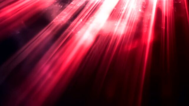 Elegant red rays light effect background with smoky particles and glowing beams