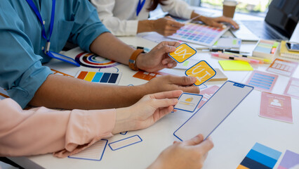 ux, ui, web and mobile app designers are discussing the look and feel of the website or app they...