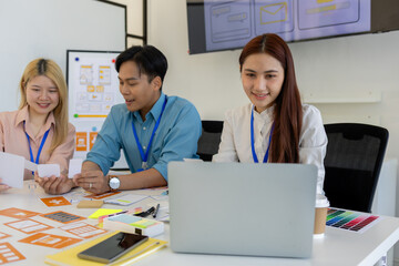 ux, ui, web and mobile app designers are discussing the look and feel of the website or app they...