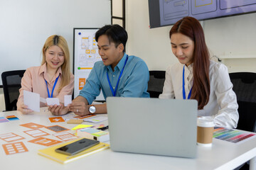 ux, ui, web and mobile app designers are discussing the look and feel of the website or app they...