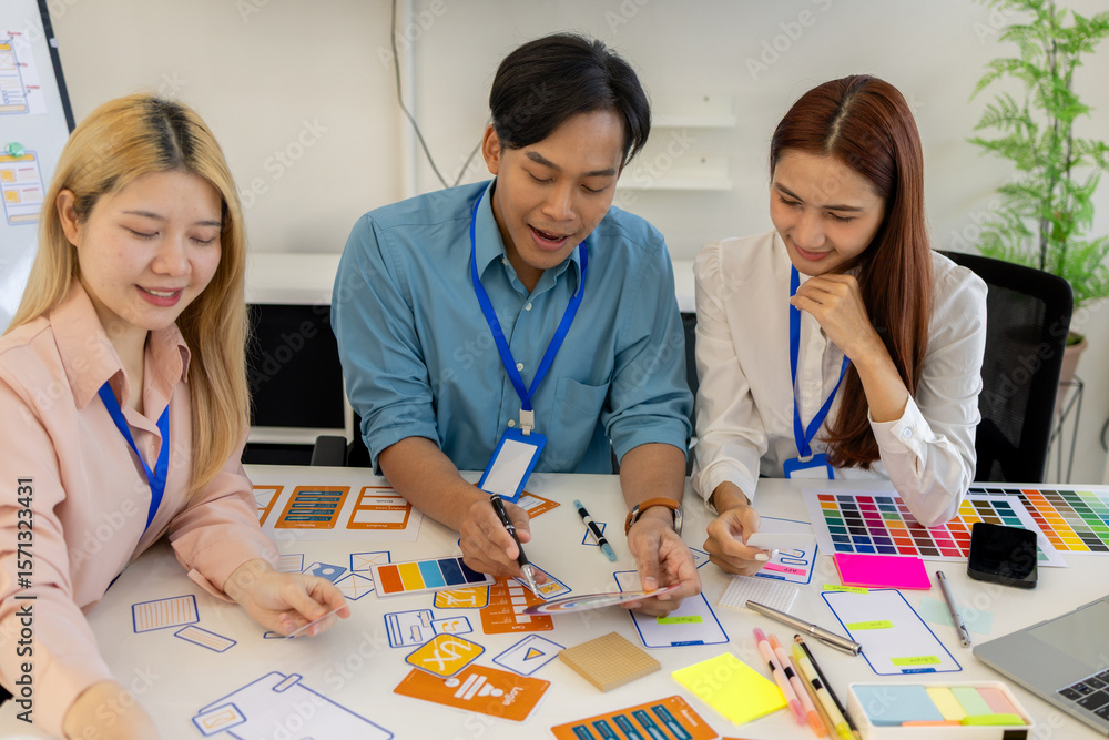Fototapete ux, ui, mobile app web designers are brainstorming to design a visual display that customers will se