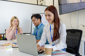 ux, ui, mobile app web designers are brainstorming to design a visual display that customers will...
