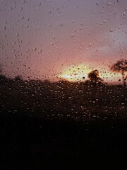 sunset behind raindrops