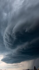 A mesmerizing sight of storm clouds swirling ominously above the city skyline before rainfall.