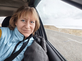 Mature blonde woman enjoying a lifestyle blogging adventure during her trip in Hong Kong