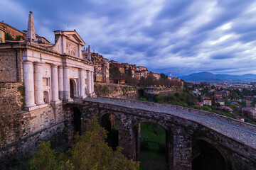 Panoramic view of Bergamo and Porta San Giacomo at sunrise from Bergamo Alta