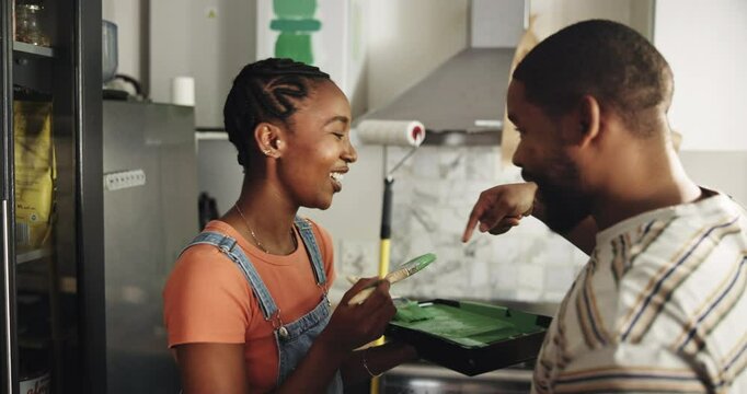 Black couple, laugh and joke with kitchen for home renovation, upgrade and bonding. New house, paint supplies and people happy for makeover with comedy, support or care with teamwork for love and diy