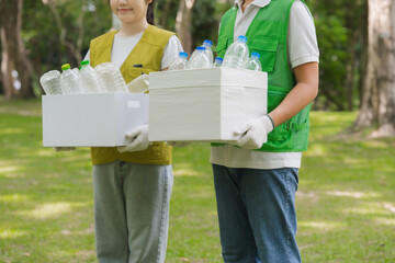 Volunteers Carrying Recycled Plastic Bottles