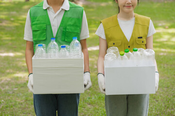 Volunteers Carrying Recycled Plastic Bottles