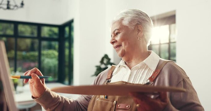 Painting, old woman and creative in home, talent or artist with paintbrush for art, smile and craft. Happy, elderly person and inspiration for project, canvas and process with watercolor in lounge