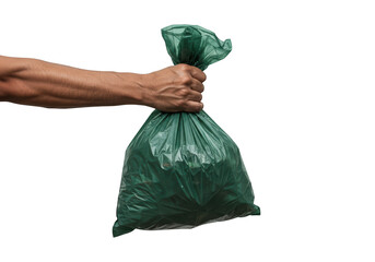 Hand holding a full green trash bag tied with a knot showcasing waste disposal and recycling efforts