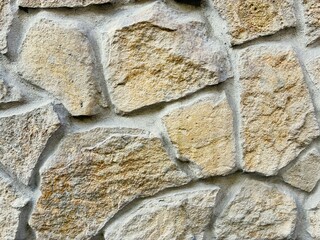 Yellowish brown sandstone cladding.