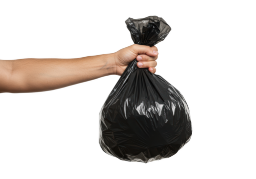 Hand holding a tied black trash bag filled with refuse against a clean isolated background symbolizing waste disposal and cleanliness