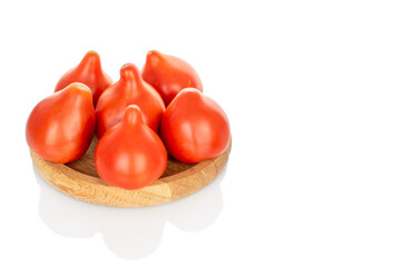 Several red juicy tomatoes, close-up, isolated on white background.