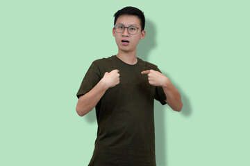 young nerd man Expressing Surprise Through a Gesturing Pose Against a studio Background
