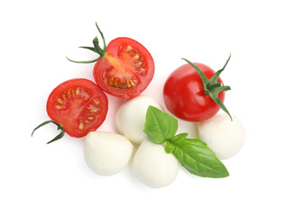 Tasty mozzarella cheese balls, tomatoes and basil isolated on white, top view