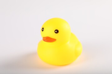 One cute rubber duck on white background, closeup