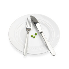 Plate with fresh green peas and cutlery isolated on white