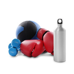 Medicine ball, dumbbells, water bottle and boxing gloves isolated on white