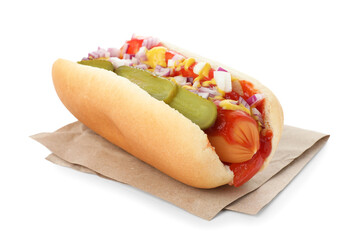 Tasty hot dog with pickles, onion, ketchup and mustard isolated on white