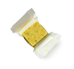 Tasty aromatic bouillon cube in wrap isolated on white, top view