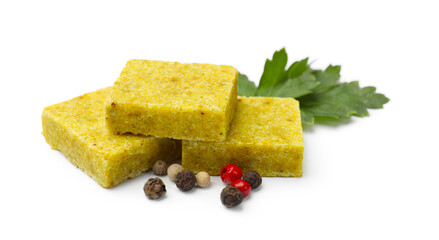 Tasty aromatic bouillon cubes, peppercorns and parsley isolated on white