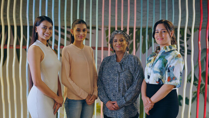 Indian happy proud senior boss ceo women lady group look cam do casual pose indoor work place....