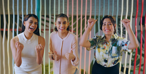 Indian happy diverse proud women lady group team leader look camera indoor show thumbs up at work place young adult female girl staff expert staring cam do funny pose hand raise job office enjoy day