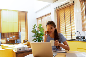 Woman enjoys book and music in modern abode.