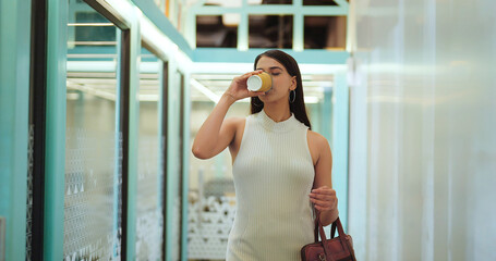 Indian young adult gen z boss ceo expert woman lady walk indoor office hallway space modern female...